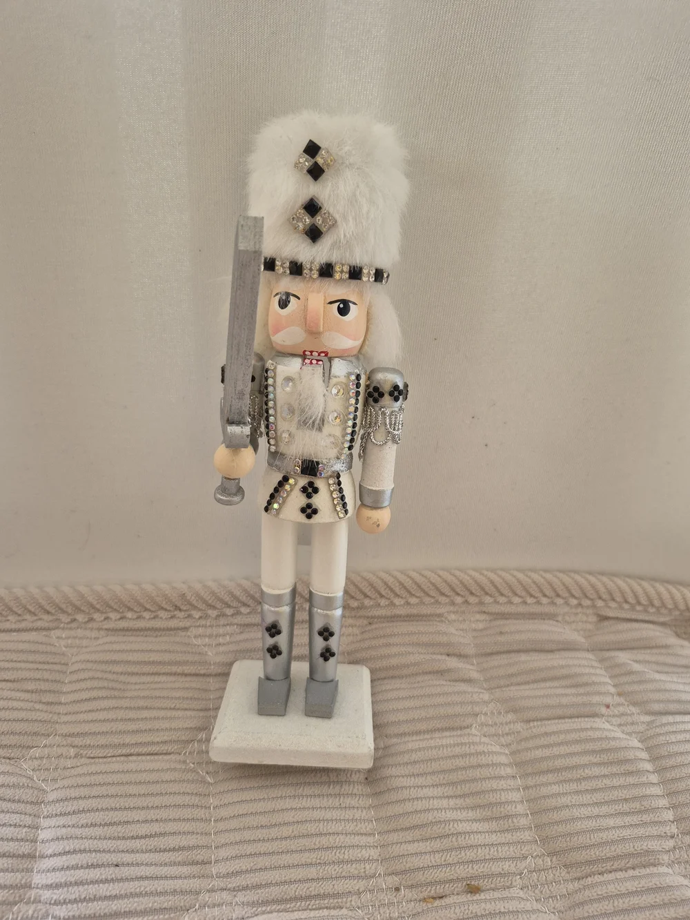White and Silver Nutcracker Figurine with Faux Fur Hat